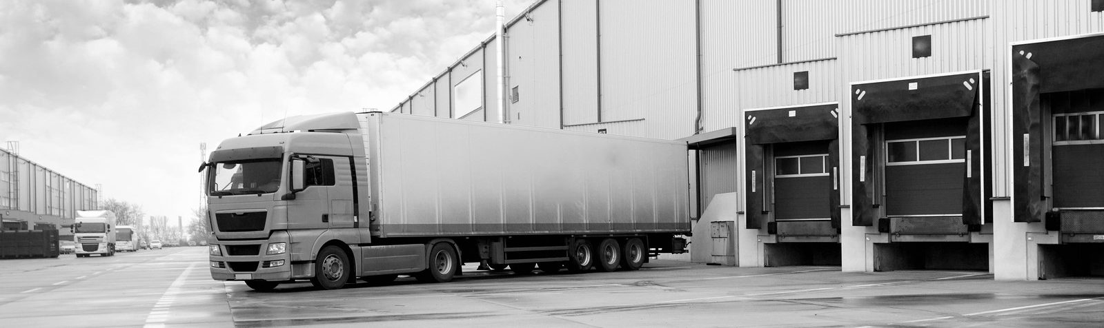 Unloading-Cargo-Truck-At-Warehouse-bw-1-e1473258710495